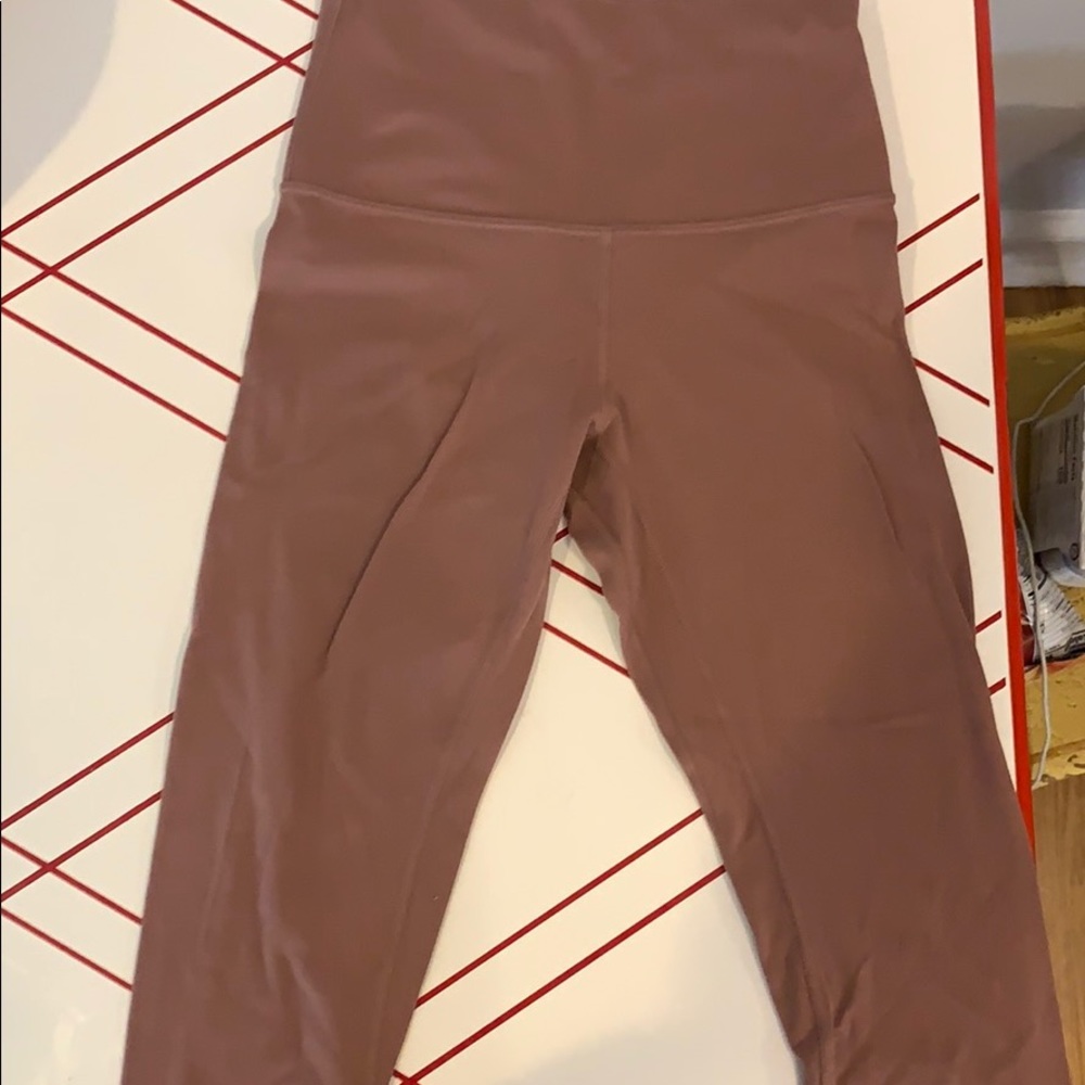 Rose colored Lululemon align crops size 4